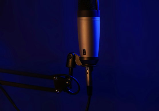a microphone on a stand in a dark room